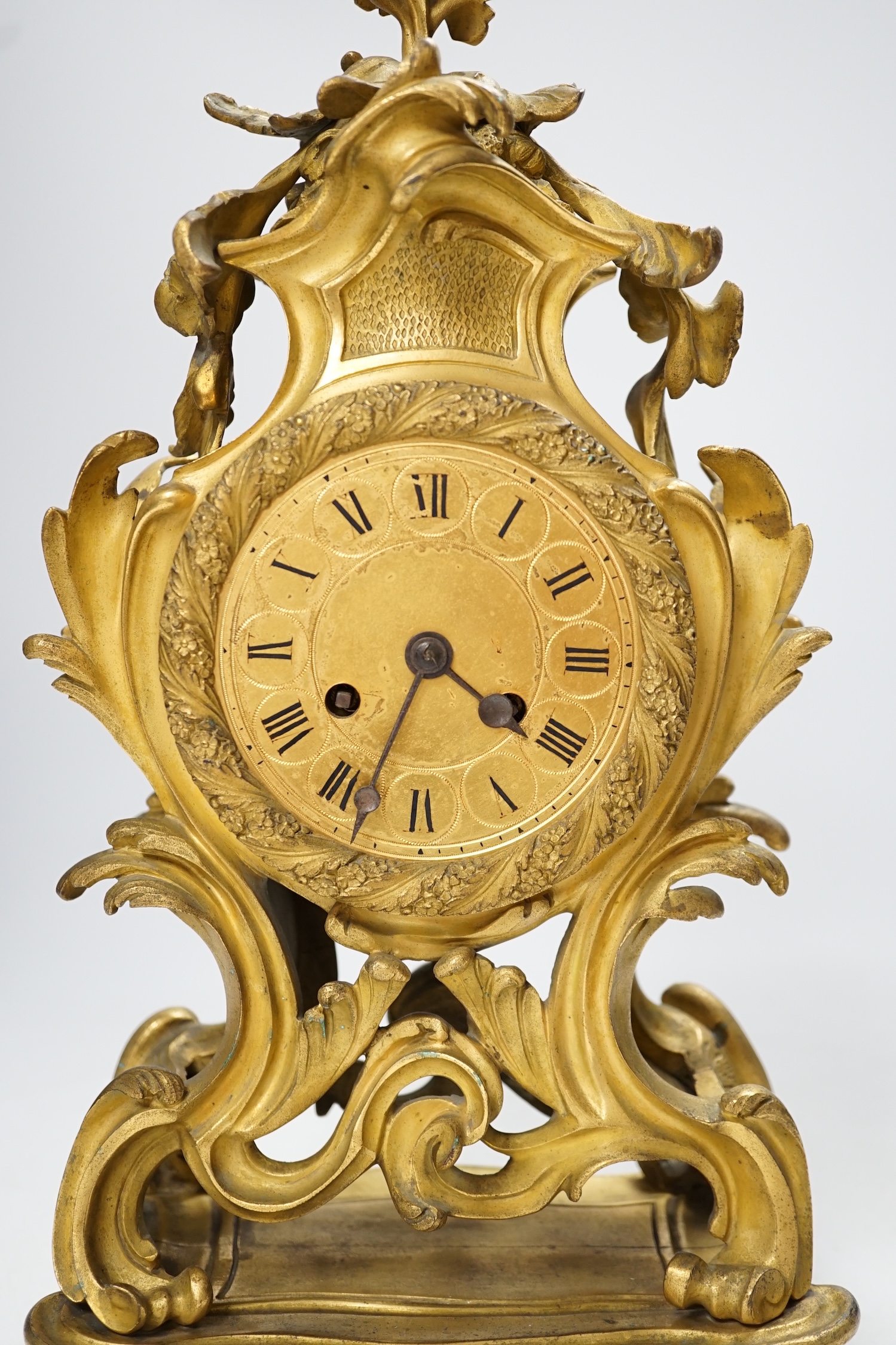 A 19th century French gilt metal mantel clock with Roman numeral dial, no key, pendulum a.f, 35cm high. Condition - fair